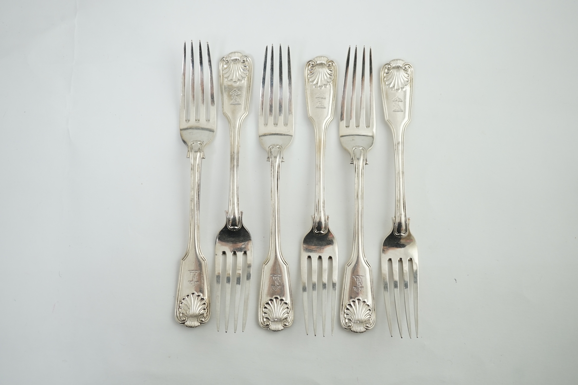 A set of six Victorian silver fiddle, thread and shell pattern table forks, by Henry John Lias and James Wakely